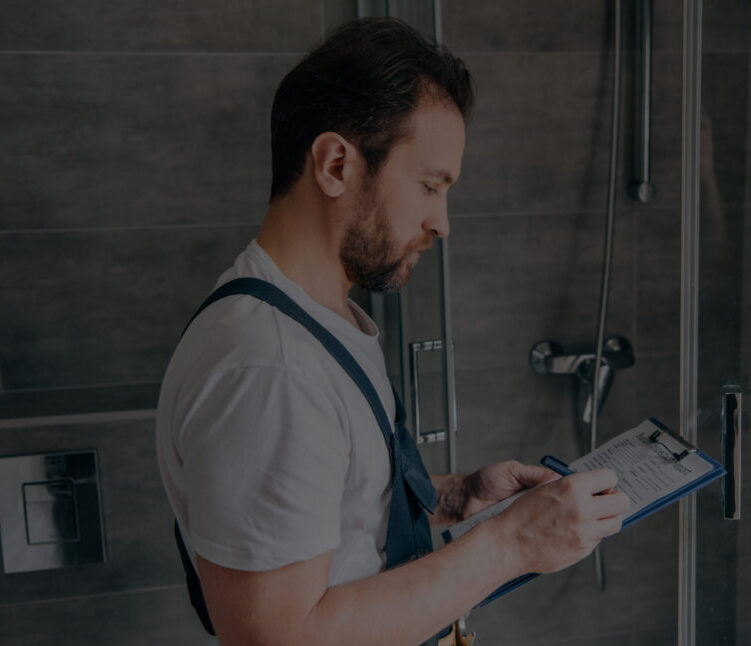 side view of male plumber making notes in clipboar 2024 11 18 19 28 59 utc 1 scaled e1761871911521